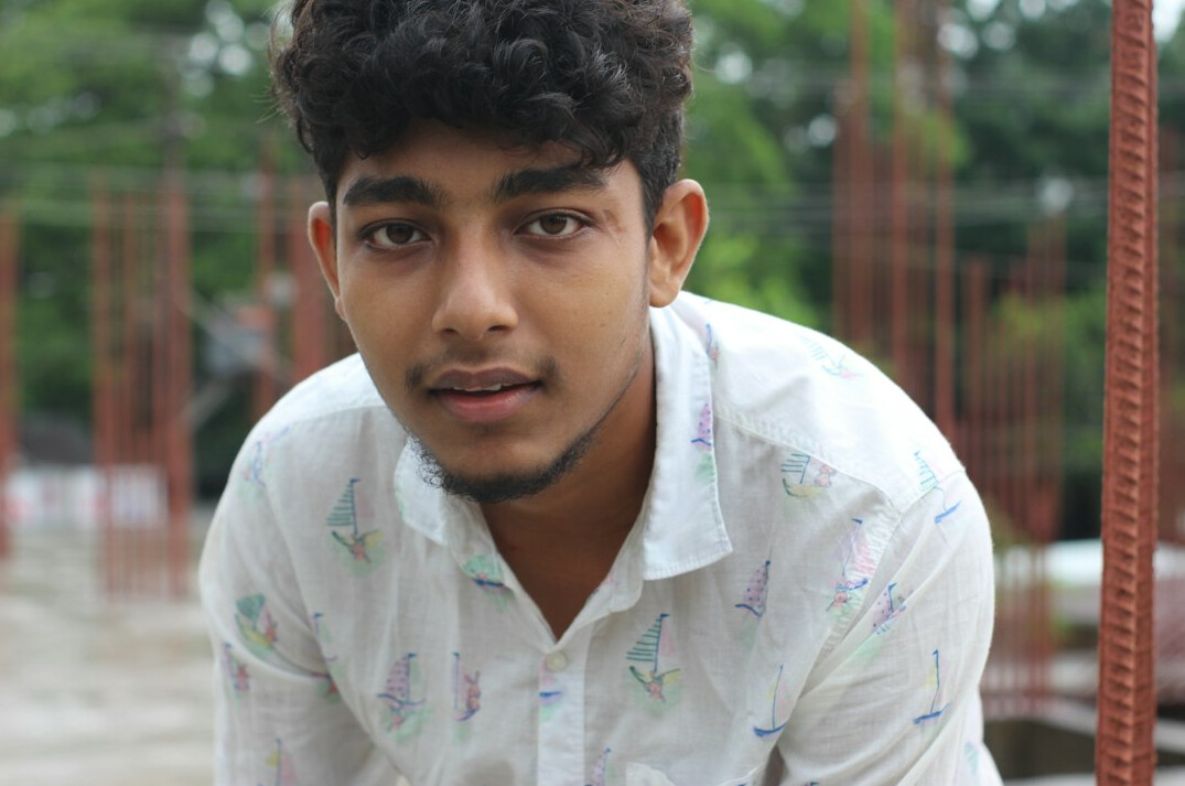Portrait of a young man in a shirt with a friendly expression